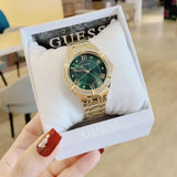 Buy Shop Guess Cosmo Diamonds Green Dial Gold Steel Strap Watch for Women - GW0033L8 USA Online